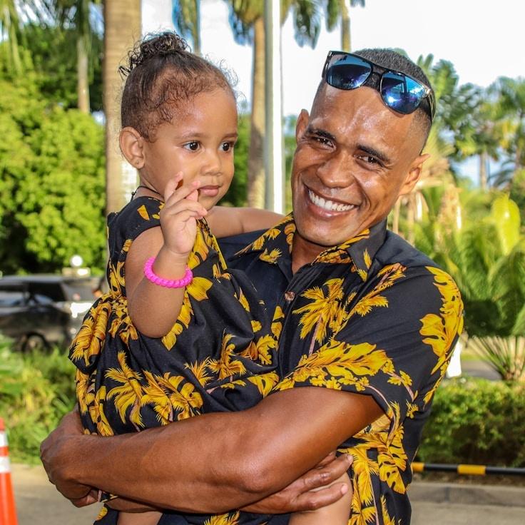 A. Rivera, Lead Design Curator at AstroNivaLora, reviewing corporate floral arrangements